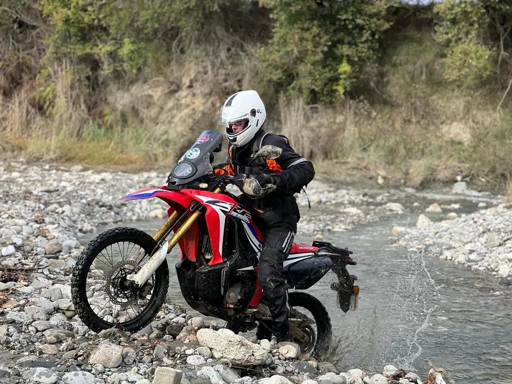 Honda CRF rider fording stream